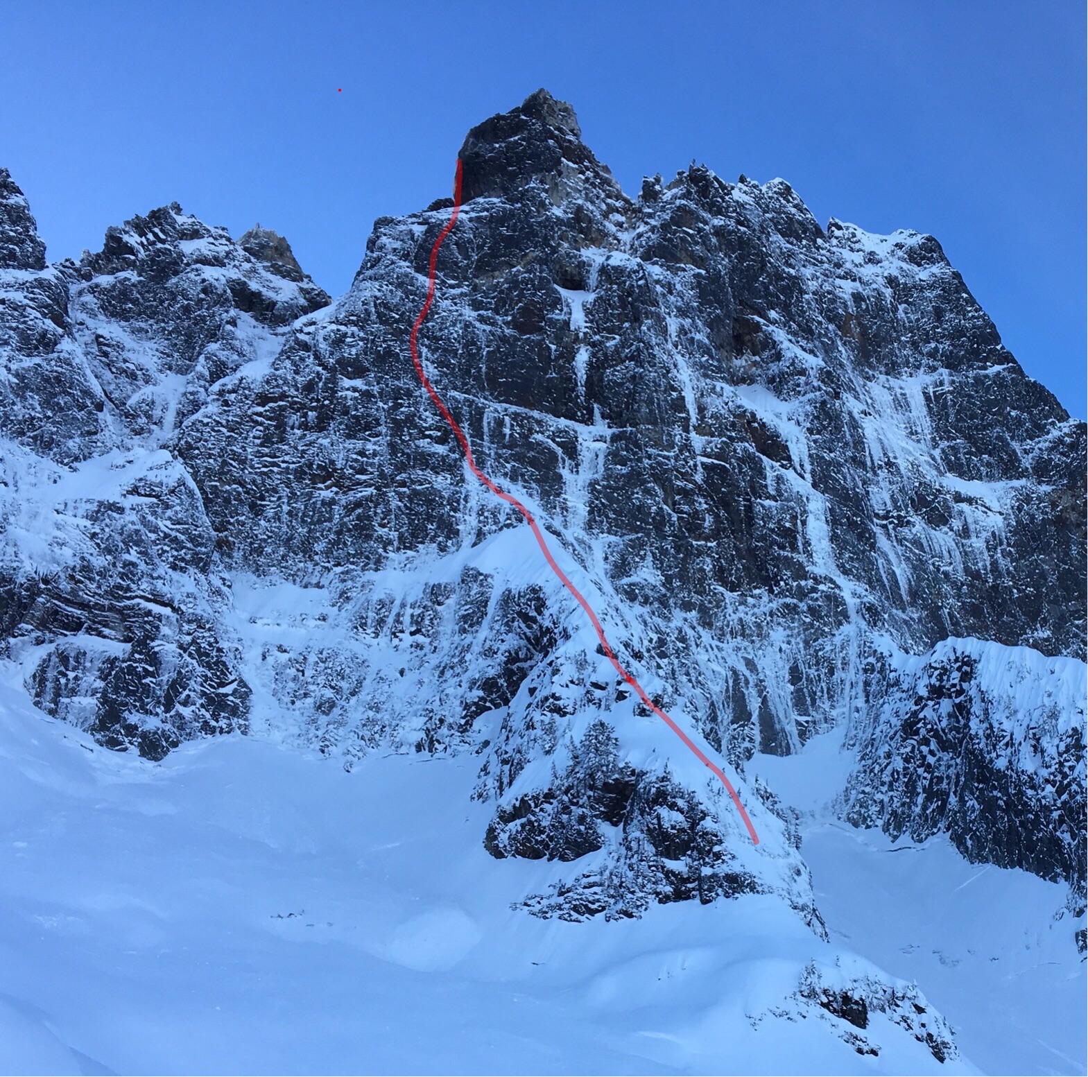 The red line shows the route taken by Marc-Andre Leclerc and Tom Livingstone on January 3 for the first winter ascent of the Navigator Wall on Canada's Mt. Slesse. They estimated the difficulties to be M7+ R or Scottish VIII or IV, according to Livingstone. [Photo] Marc-Andre Leclerc