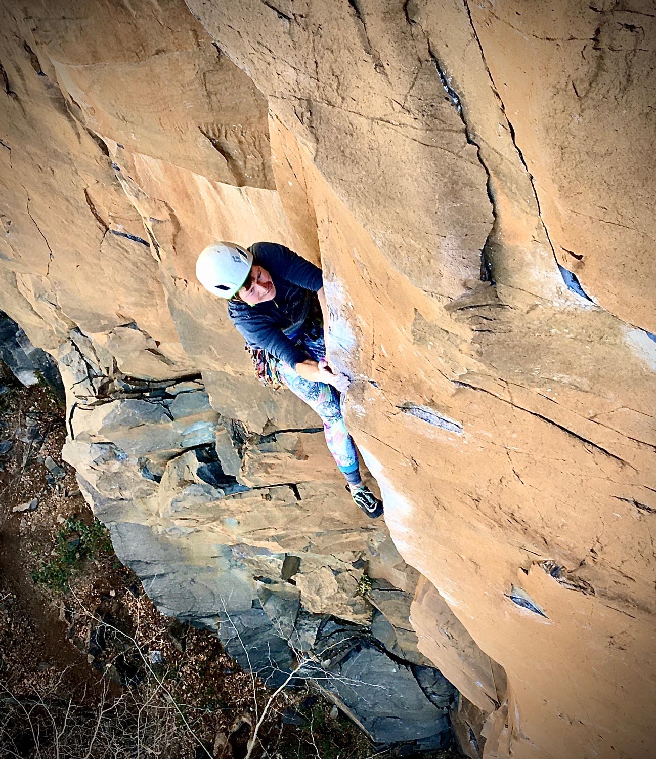 Lor Sabourin staring down the crux of East Coast Fist Bump (5.14a) at The Waterfall