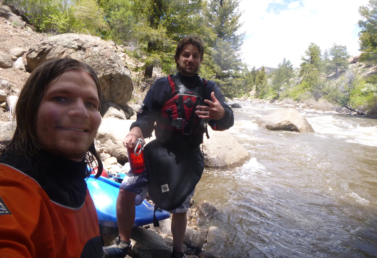 Franz celebrates with his longtime kayaking buddy Brian Wright after completing a clean run on the famous Class IV Numbers section of the Arkansas River, Colorado, June 1, 2015. Wright, who now lives in Alaska, has also been using the Ombraz sunglasses and agrees that they have excellent utility. Franz and Wright have been paddling together since they got their driver licenses in high school. [Photo] Derek Franz