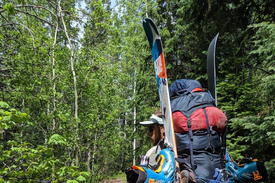 Drew Thayer carries the Osprey Mutant 52 backpack loaded with ski mountaineering gear and a large four-season tent for a climb of Mt. Daly, Elk Range, Colorado. Crampons are tied on with cord to the rear daisy chains. [Photo] Lillian Hancock