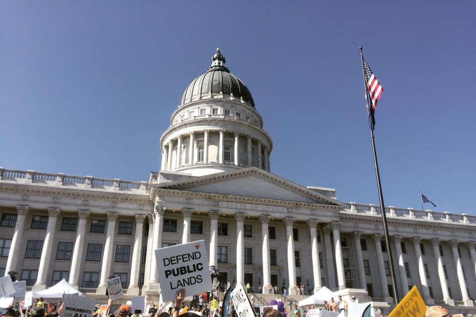 The This Land is Our Land March for Public Lands congregated in front of the Utah capitol in Salt Lake City on July 27 in conjunction with the last Outdoor Retailer Summer Market trade show to be hosted by the city. OR recently agreed to move the trade show to Denver starting next year in response to Utah lawmakers' continued efforts to rescind Bears Ears and Grand Staircase Escalante National Monuments. [Photo] Emma Murray