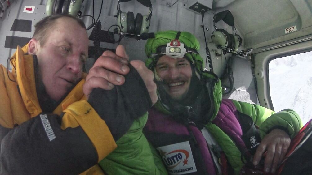 Urubko and Bielecki in the helicopter after the rescue. [Photo] Courtesy of Denis Urubko