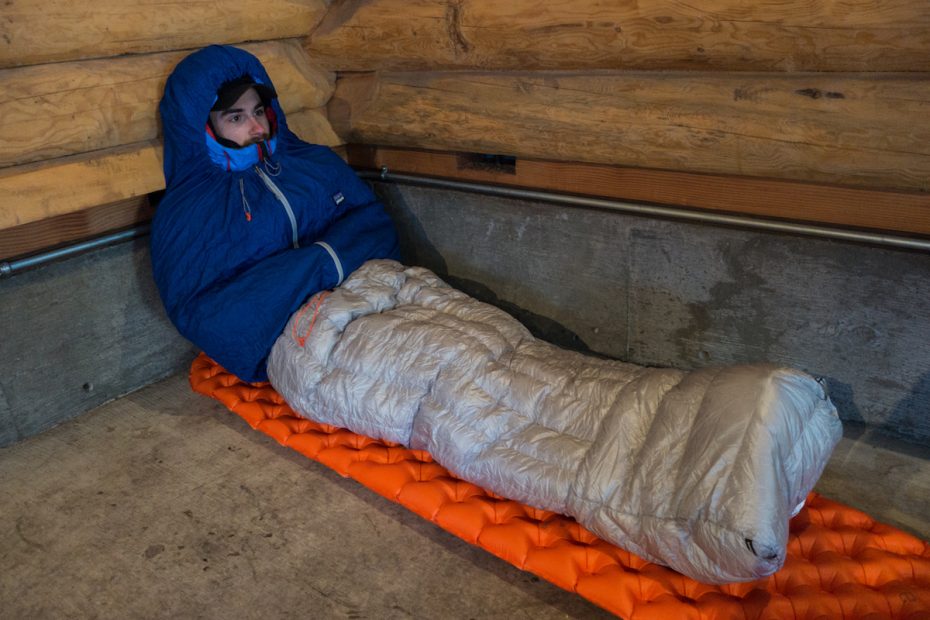 The author before a night at a large shelter outside Crater Lake National Park, Oregon. A roaring wood stove inside meant I could get a comfortable night's sleep with just a light synthetic jacket as my top layer. [Photo] Ryan Wichelns