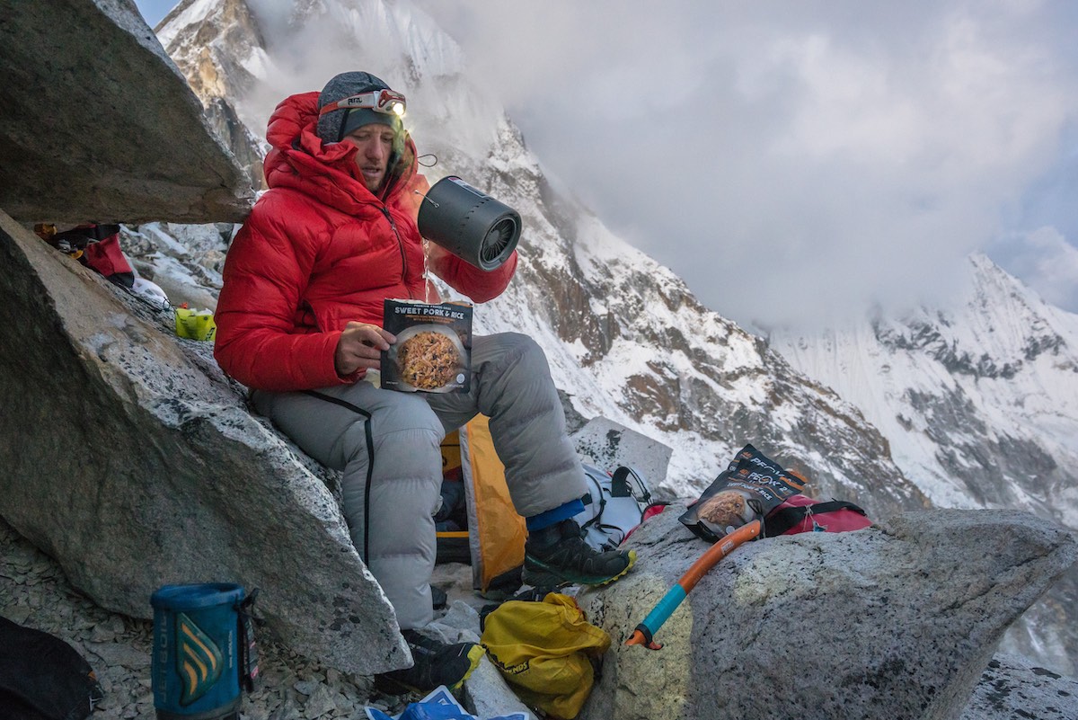 The author preparing the Peak Refuel Sweet Pork and Rice entree at Camp 1 on Ama Dablam in Nepal. [Photo] Clint Helander collection
