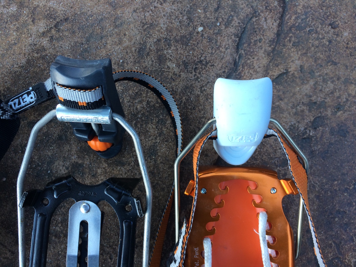 The Petzl Dart (left) and the Petzl Irvis Hybrid (right) have different heel levers. The Dart has a flatter, secondary edge that aids in housing the lever to a boot welt. This makes clipping the heel lever much easier than the Irvis Hybrid, which does not have the secondary edge. [Photo] Mike Lewis
