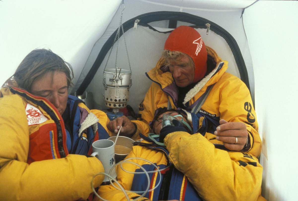 Photo caption reads, “Laurie helps Dwayne and me recover at Camp Five on our descent from the summit.” [Photo] Dan Griffith, courtesy of Mountaineers Books