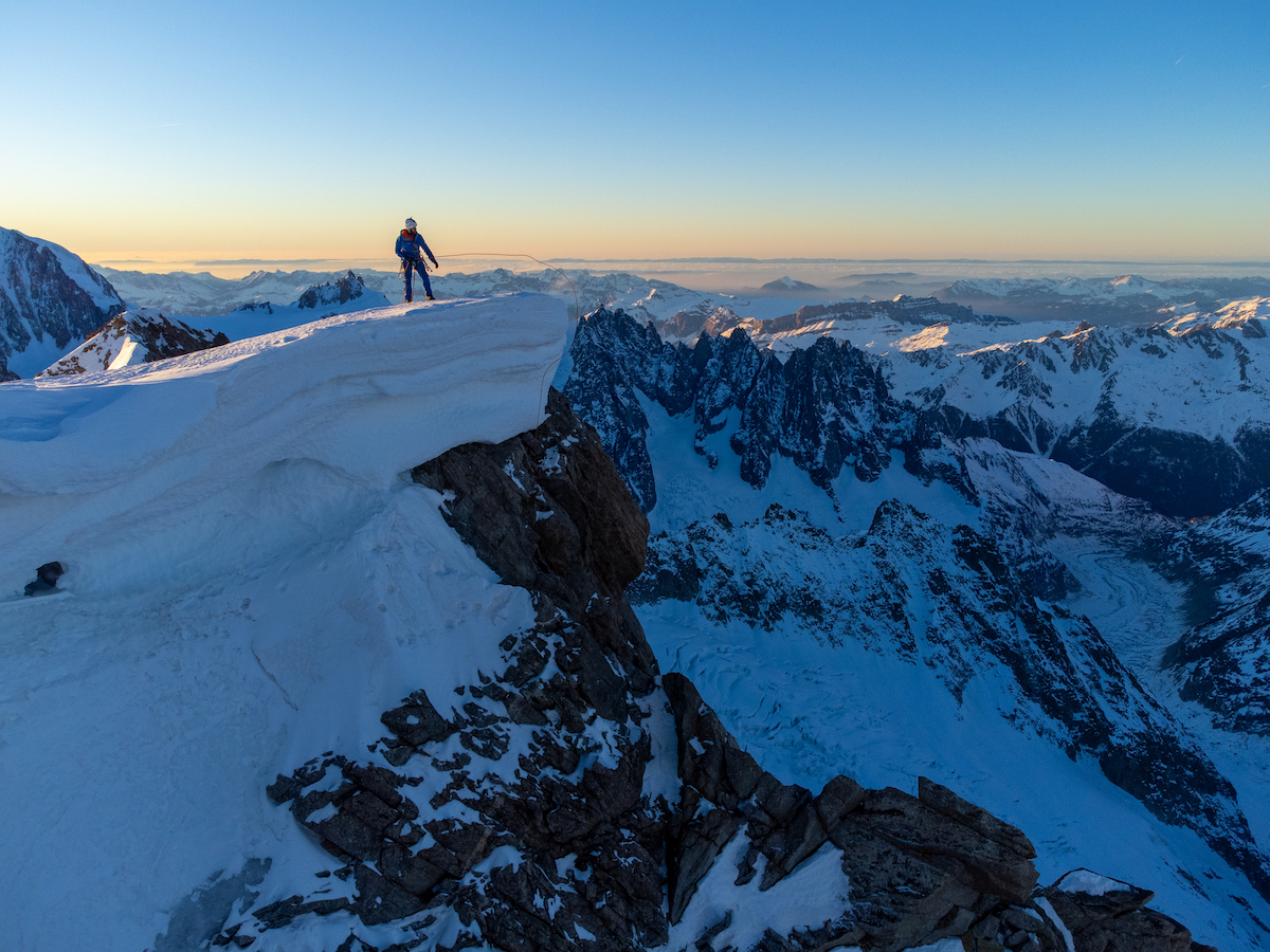Charles Dubouloz summits the Walker Spur of the Grandes Jorasses after soloing Rolling Stones (5.10 A3, or M8, 1100m) over six days in January. [Photo] Seb Montaz Studio (@sebmontazstudio)