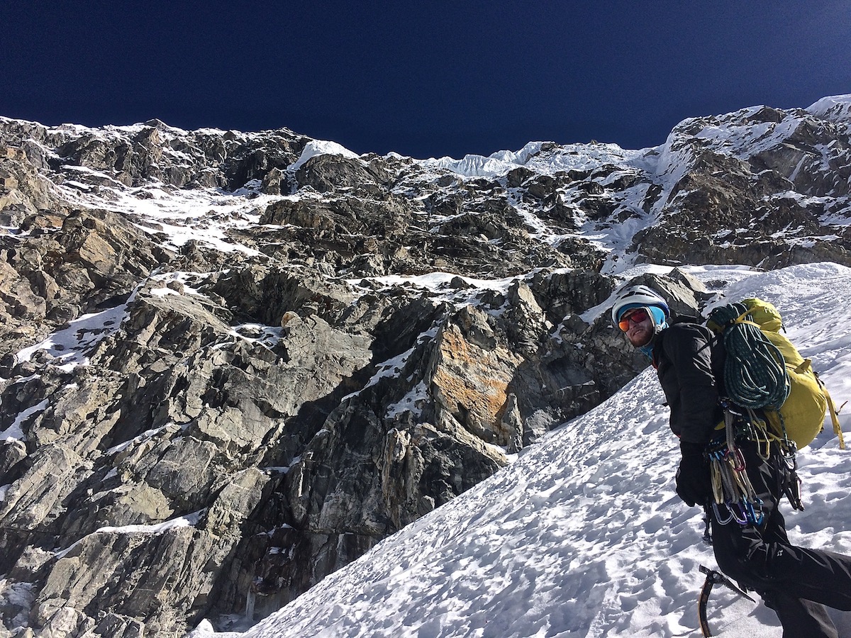 Mirhashemi stands below the west face of Chugimago on the way down from another successful ascent. [Photo] Mark Pugliese