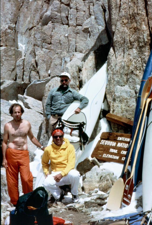 Reg Lake, Robbins and Doug Tompkins take a break from schlepping their kayaks at the top of the 13,777-foot pass on Mt. Whitney en route to the headwaters of the Kern. [Photo] Reg Lake collection