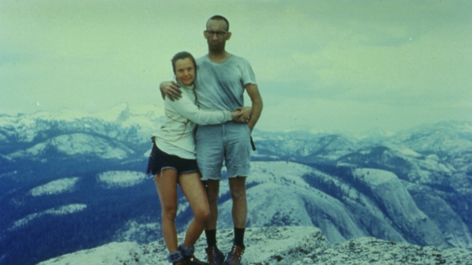 Royal and Liz Robbins on top of Half Dome after Liz became the world's first woman to climb the Northwest Face, June 1967. It was the tenth anniversary of Royal's first ascent of the wall. Liz said that they got the idea to start a clothing company for climbers after they saw how ragged they looked in this photo. [Photo] Robbins family collection