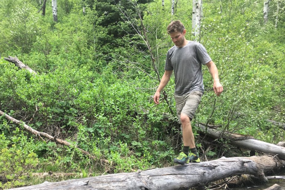 The author appreciating the sticky rubber of the Salewa Wildfire Edge approach shoes during a log crossing on a backpack trip in western Colorado last June. [Photo] Mandi Franz