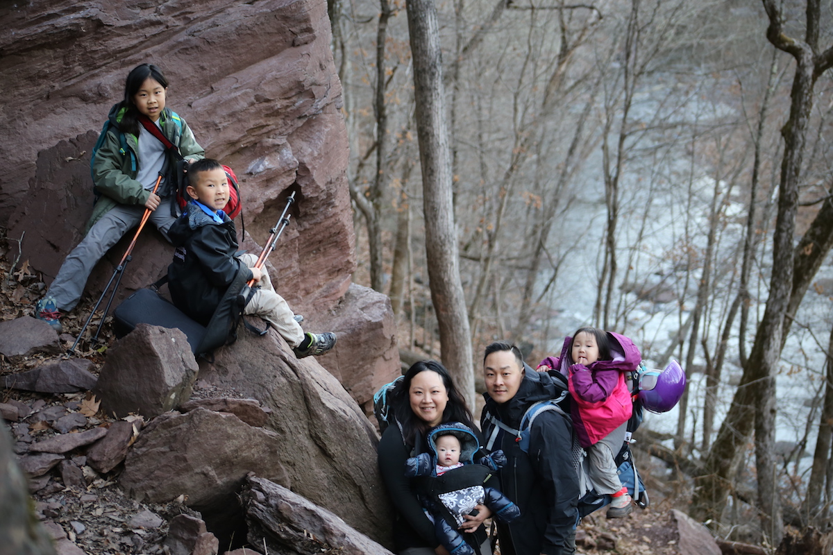 Leslie Hsu Oh is pictured here with her family at the cliffs of red Lockatong argillite and Brunswick shale along the Tohickon Creek, Pennsylvania. [Photo] Joe Forte