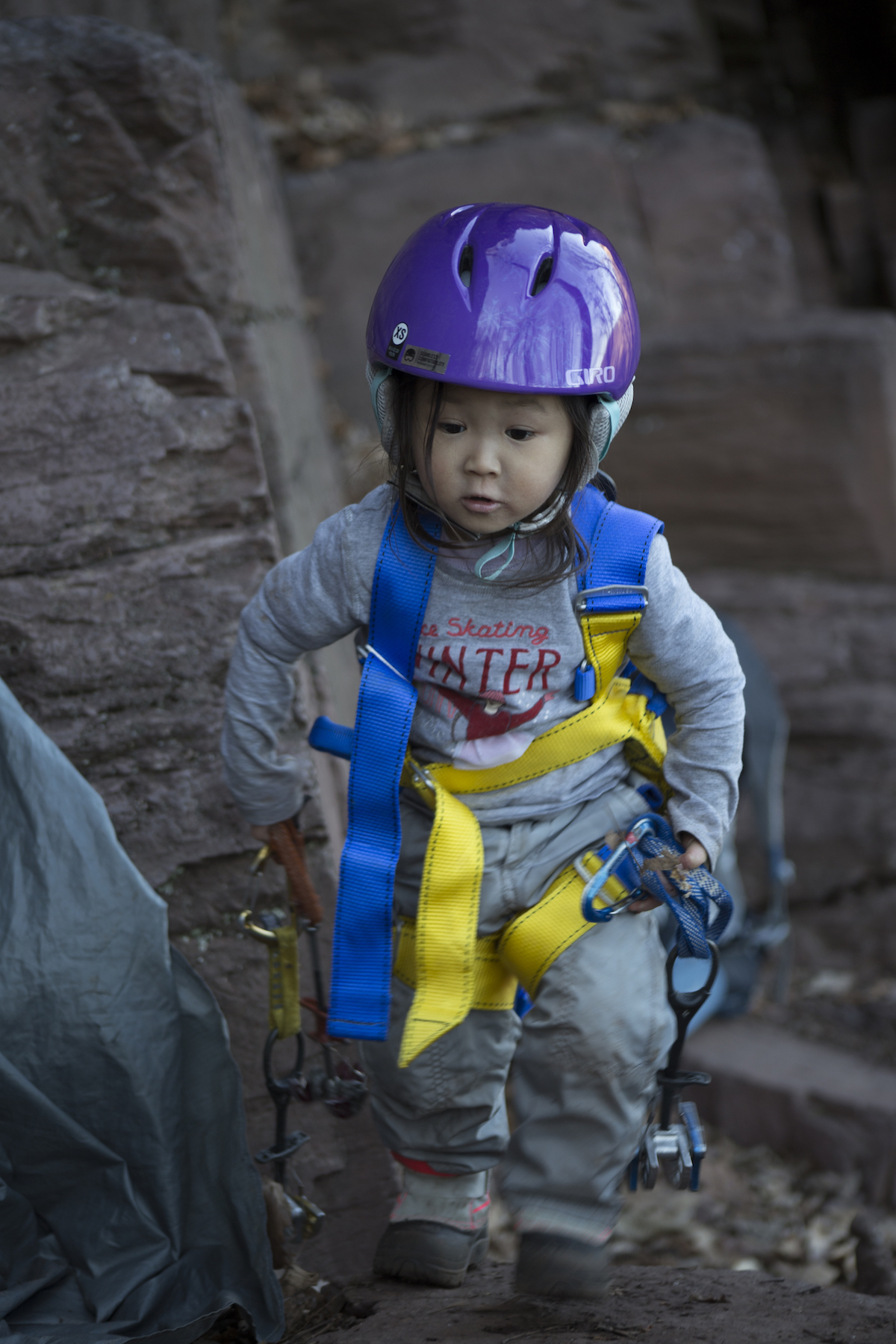 Three-year-old Riley retrieves some cams for her brother. [Photo] Leslie Hsu Oh
