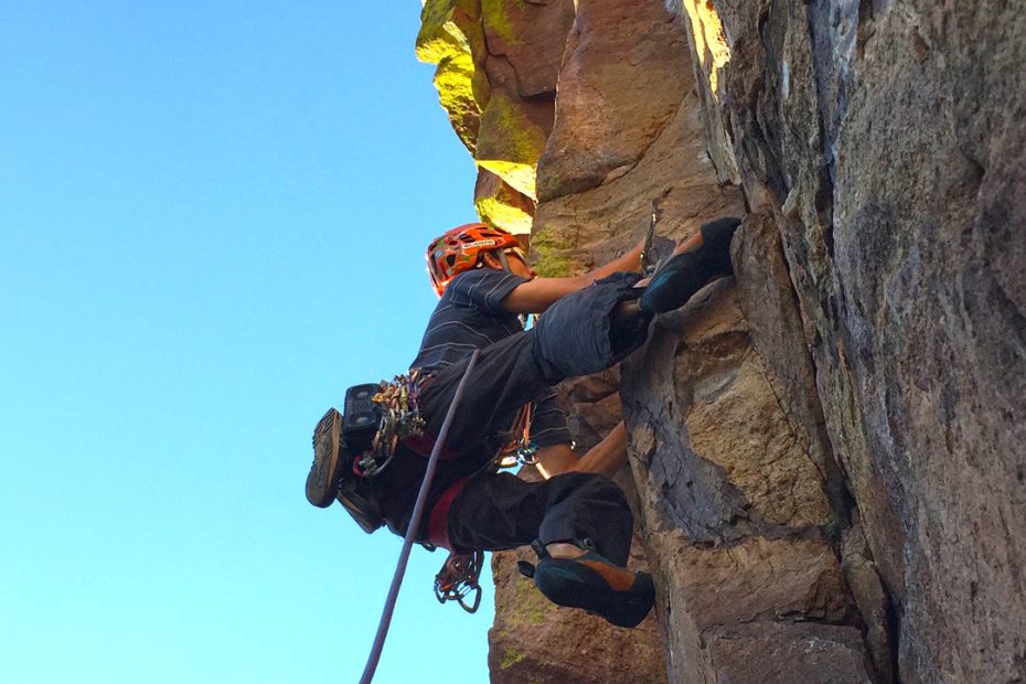 Scott Bennett approaching the crux on the Naked Edge (5.11b, 460').