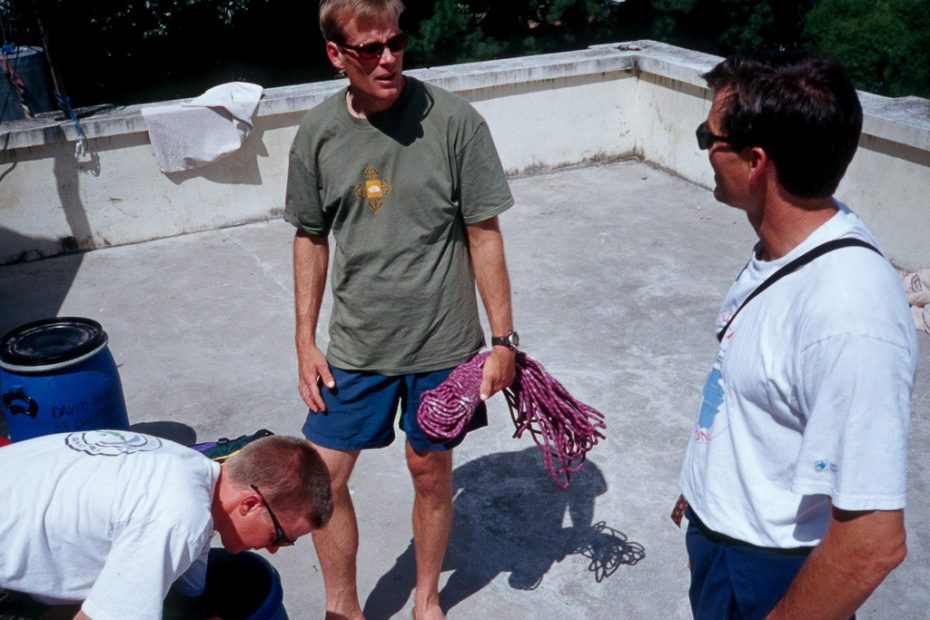 David Bridges (left), Conrad Anker (middle) and Alex Lowe sorting gear on a rooftop in Kathmandu before the 1999 Shishapangma trip. [Photo] Andrew McLean