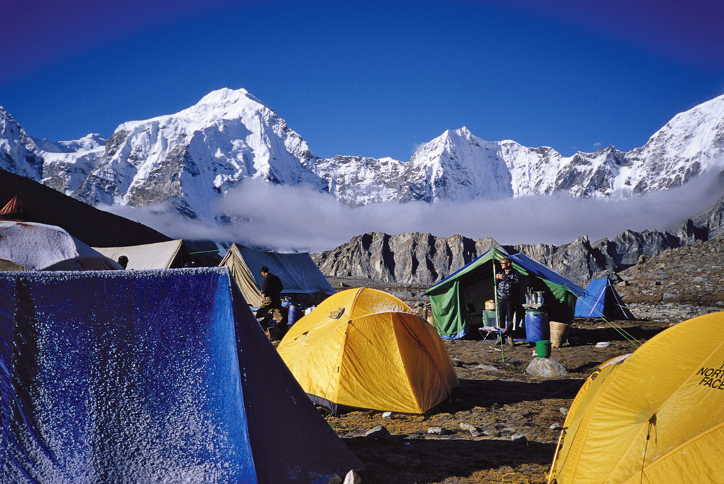Anker drinking coffee at the Shishapangma base camp. [Photo] Andrew McLean