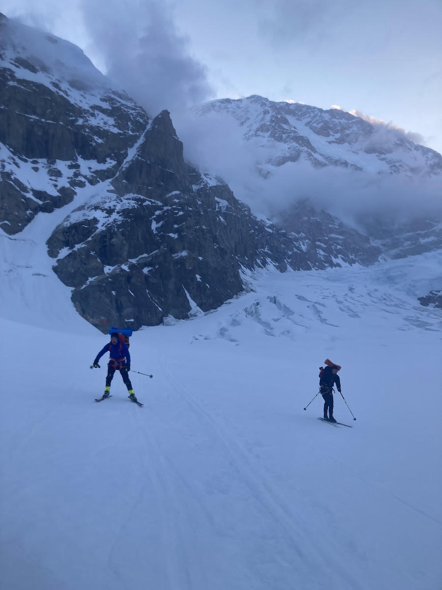 Skiing out after collecting gear. The south face of Denali is in the background. [Photo] Michael Gardner