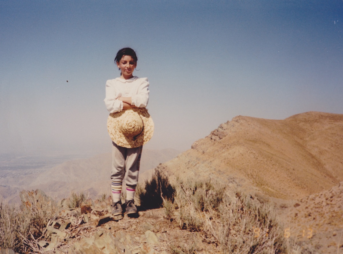 The author as a girl on top of Mt. Azimiyeh, a peak she climbed many times with her dad. [Photo] Shirin Shabestari collection