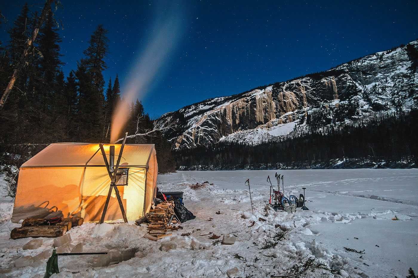 Base camp on the frozen Nipissis River below the M51 cliff, in Nitassinan, the Innu name for this land that overlaps with northeastern Quebec. [Photo] Maarten van Haeren