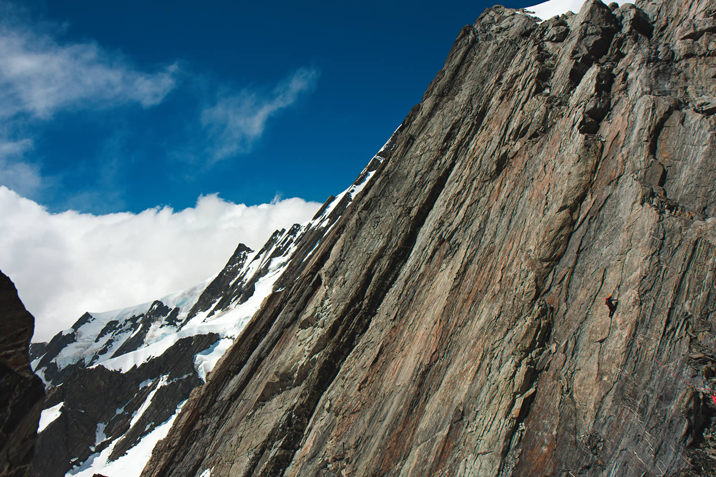 Jamie Vinton-Boot near the end of Stuntman and Chronic (5.9, five pitches) before the West Rib (5.8, eight pitches) of Mt. Walter. In the background is the West Ridge of Elie de Beaumont. [Photo] Kester Brown