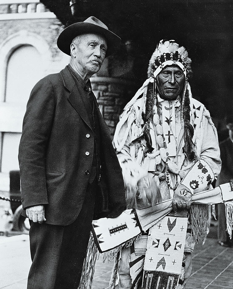 Tom Wilson (left) and Chief Hector Crawler pose for a photo at the CPR's "Banff Indian Days," 1927. [Photo] Glenbow Archives
