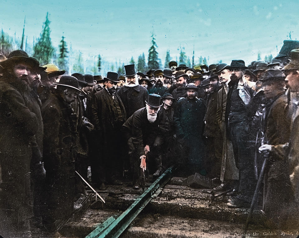 Driving the last spike of the rail line, November 7, 1885. [Photo] A.J. Ross/Whyte Museum of the Canadian Rockies