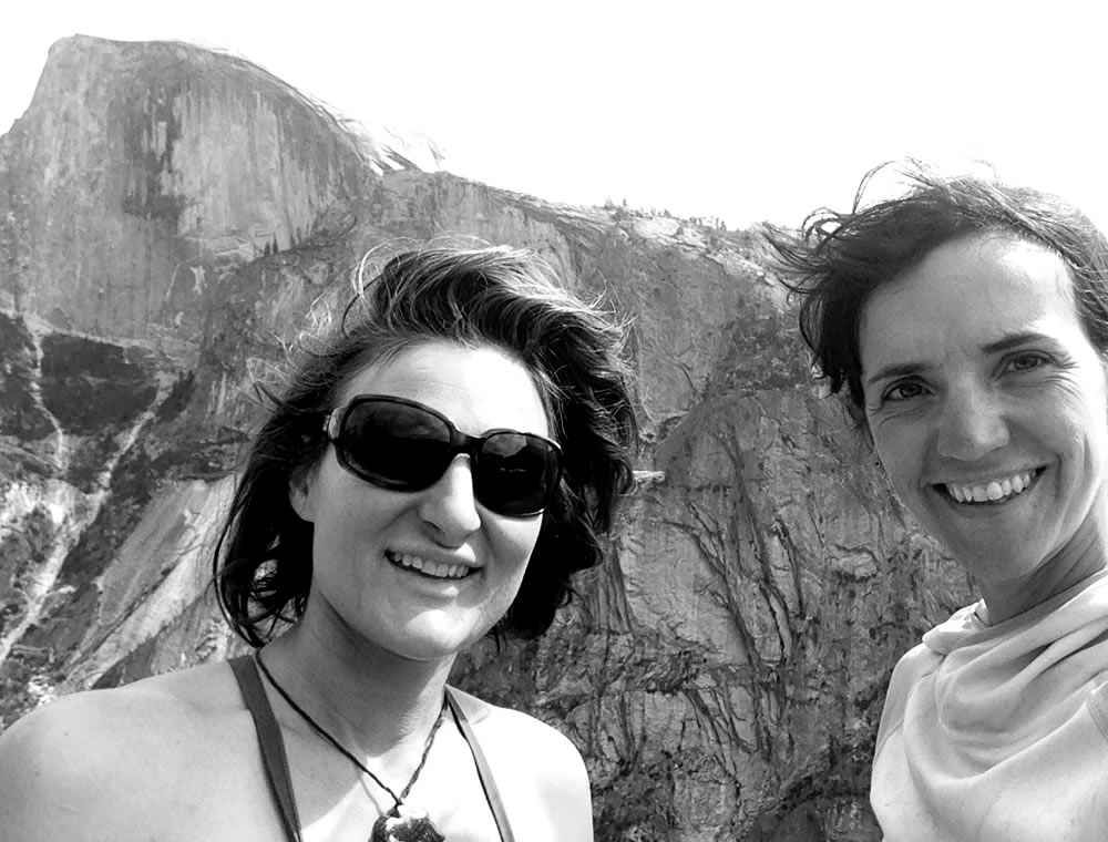 Josie McKee, left, and Quinn Brett stand atop Washington Column on Day 5. Half Dome, which they climbed the following day, is in the background. [Photo] Quinn Brett