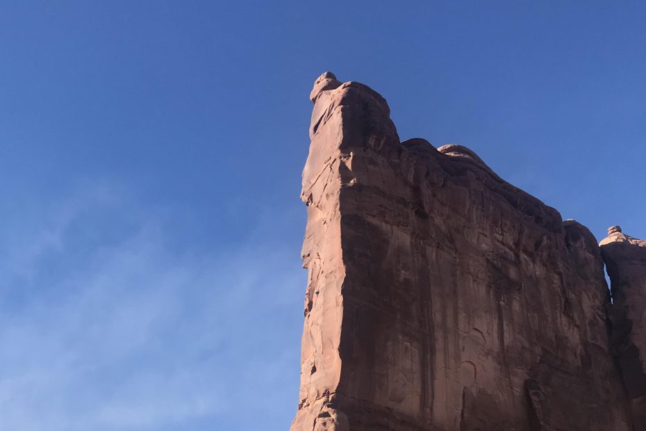 The author can be seen as a tiny dot in middle of the prow, halfway up the Tower of Babel in Arches National Park during his solo ascent of Zenyatta Entrada (5.8 C3-, 450') in February (Anasazi, Hopi, Navajo, Ouray, Paiute, Uintah, Ute, Zuni land). [Photo] Mikenna Clokey