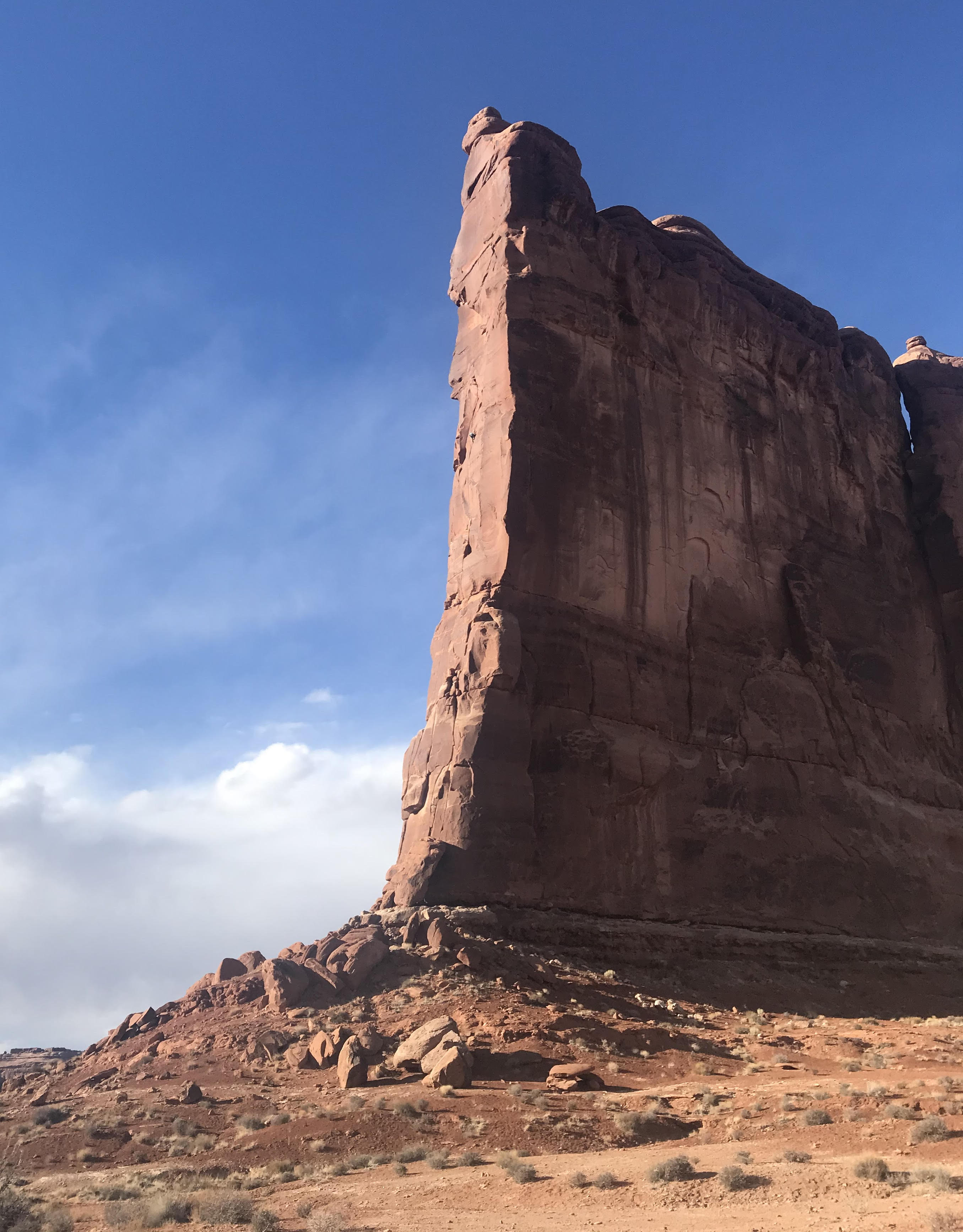 The author can be seen as a tiny dot in middle of the prow, halfway up the Tower of Babel in Arches National Park during his solo ascent of Zenyatta Entrada (5.8 C3-, 450') in February (Anasazi, Hopi, Navajo, Ouray, Paiute, Uintah, Ute, Zuni land). [Photo] Mikenna Clokey