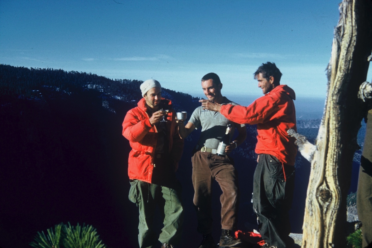 George Whitmore, Wayne Merry, and Warren Harding toast their hard won success after completing the first ascent of the spectacular Nose of El Capitan on November 12, 1958. [Photo] Wayne Merry collection