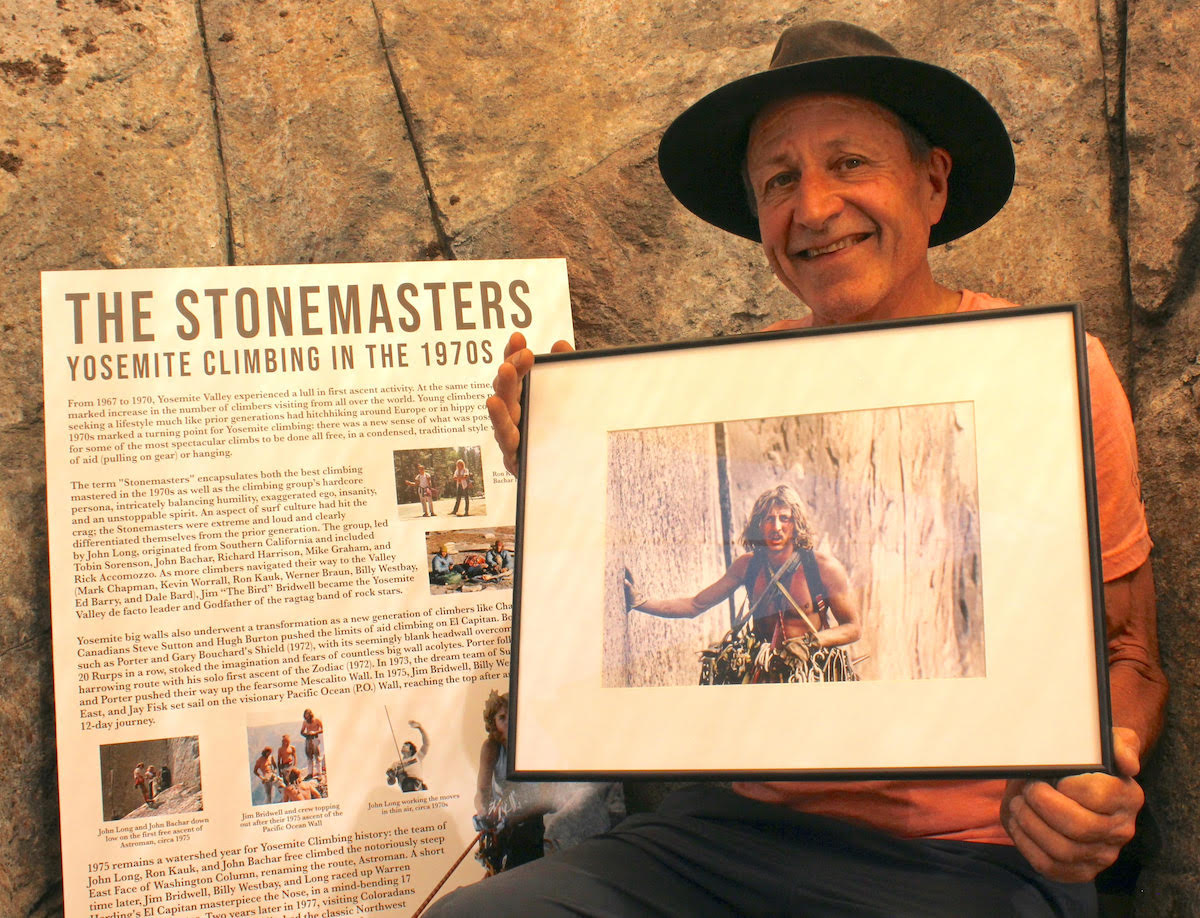 Ken Yager at the Yosemite Climbing Museum holding one of the most iconic photos of Werner Braun, taken by Jim Bridwell on the Pacific Ocean Wall, El Capitan. [Photo] Earl Bates