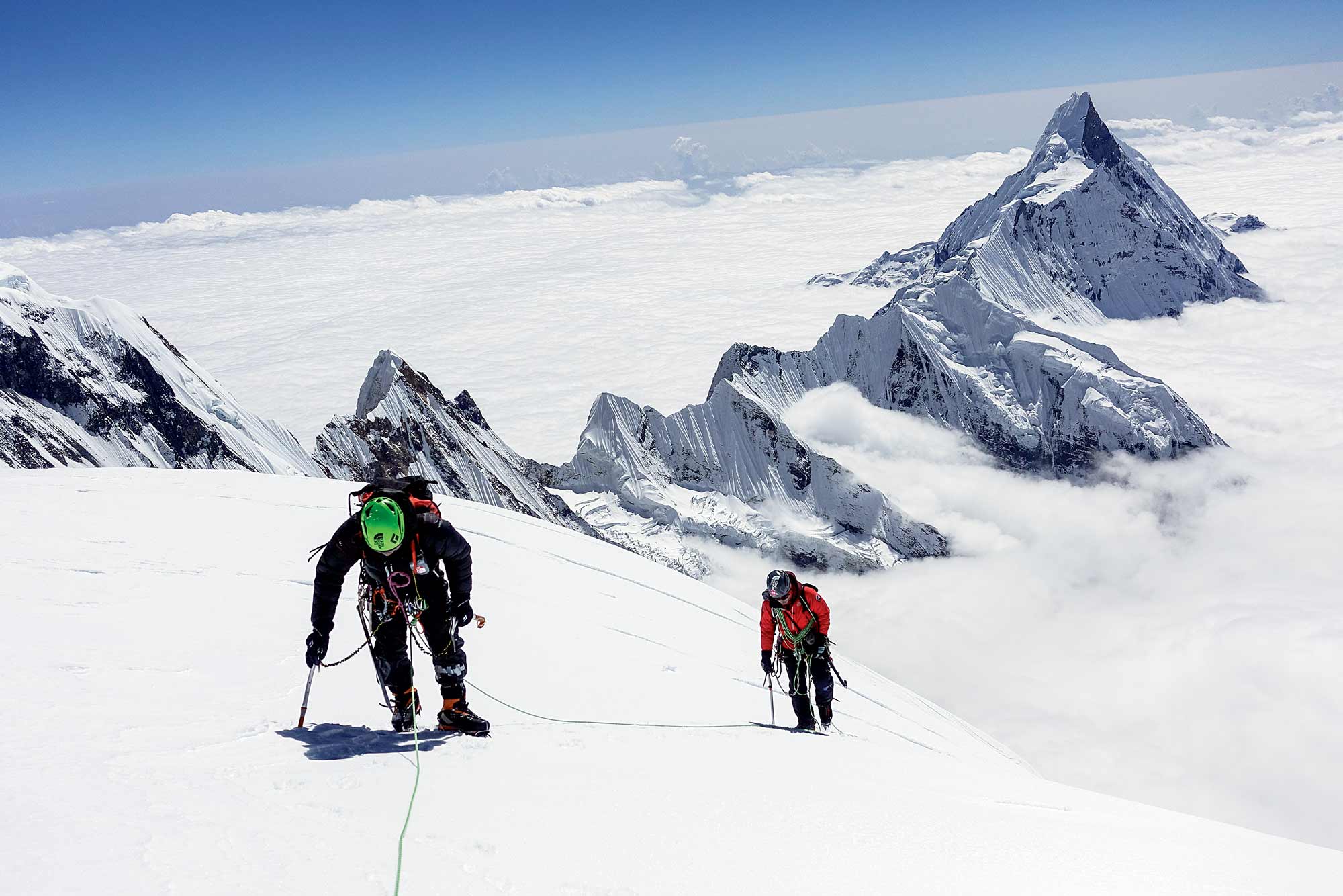Park Joung-yong and Choi Suk-mun below the summit of Gangapurna (7455m), Nepal, in October 2016, with Kim Chang-ho. [Photo] Kim Chang-ho, Choi Suk-mun collection
