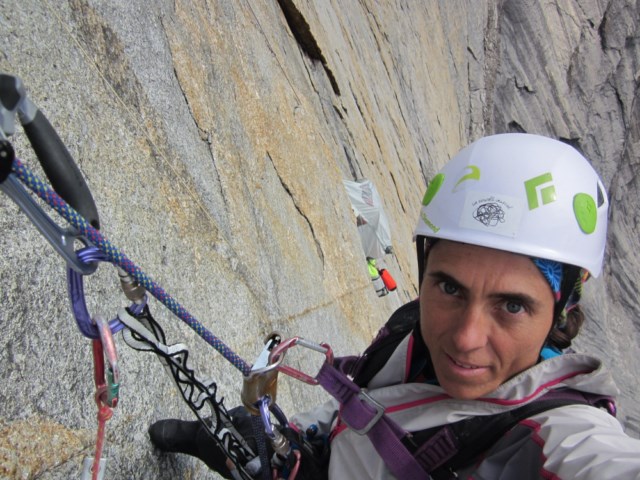 Silvia Vidal pauses for a selfie while cleaning a pitch on her route Une pas mes (VI 5.10b A4/A4+, 11 pitches). [Photo] Silvia Vidal