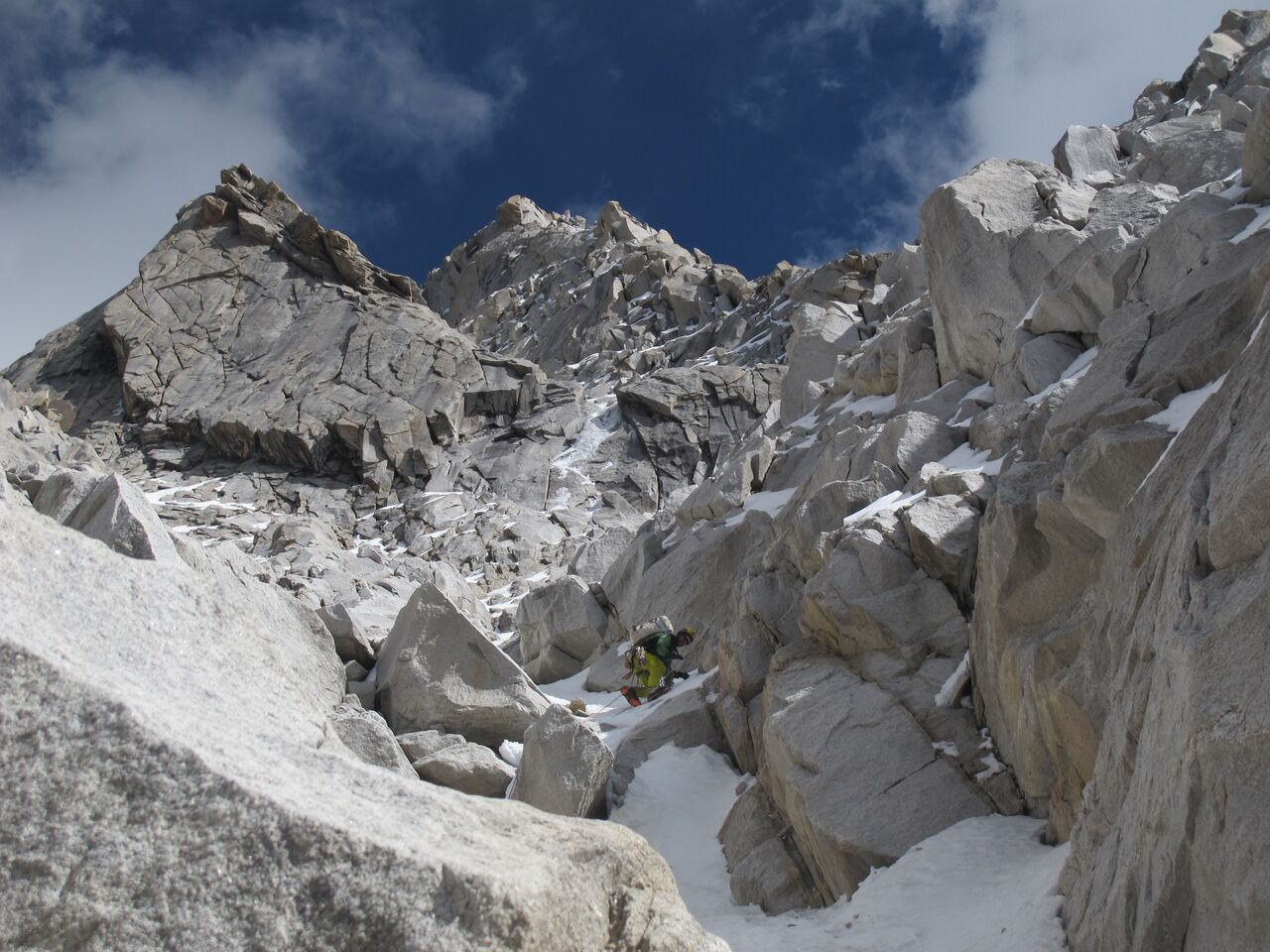 Ed Hannam leads below the traverse to the upper pitches at around 5350 meters. [Photo] Rob Baker.