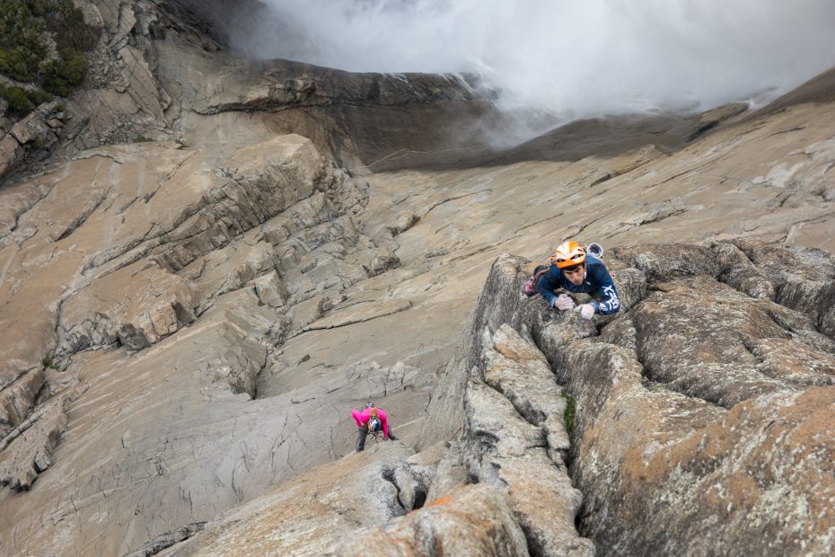 With Yosemite Falls rumbling to his left, Jon Cardwell face climbs into the final 5.12 splitter crack on Pitch 13 of the Misty Wall (5.13, 1,700') during a free ascent with Sasha DiGiulian on May 27. Cardwell had previously freed the individual pitches with Marcus Garcia last autumn, but the recent ascent is the first time the route has been free climbed in a continuous push, which took about 14.5 hours. [Photo] Marcus Garcia