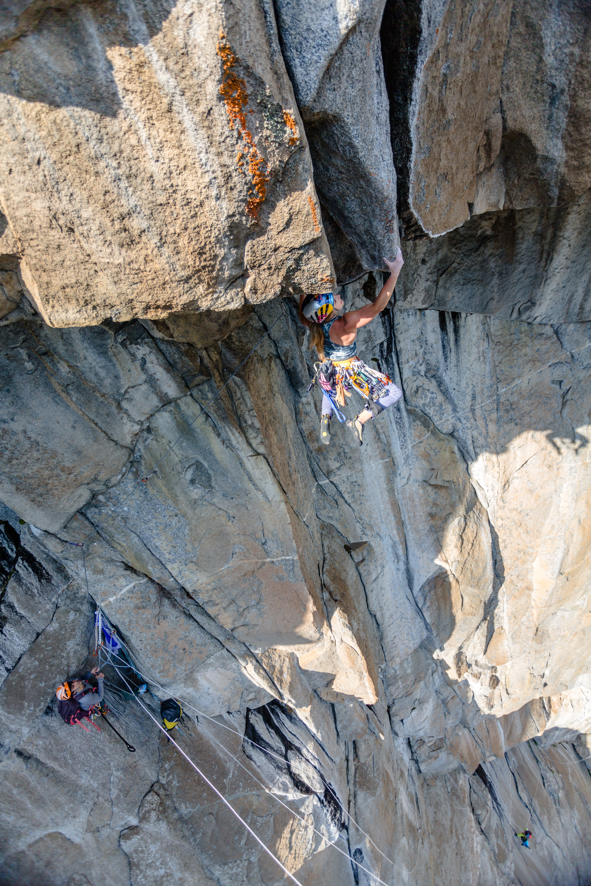 DiGiulian works the moves of the 5.13 roof crux on the Misty Wall before her free ascent with Cardwell, who is at the belay. [Photo] John Evans