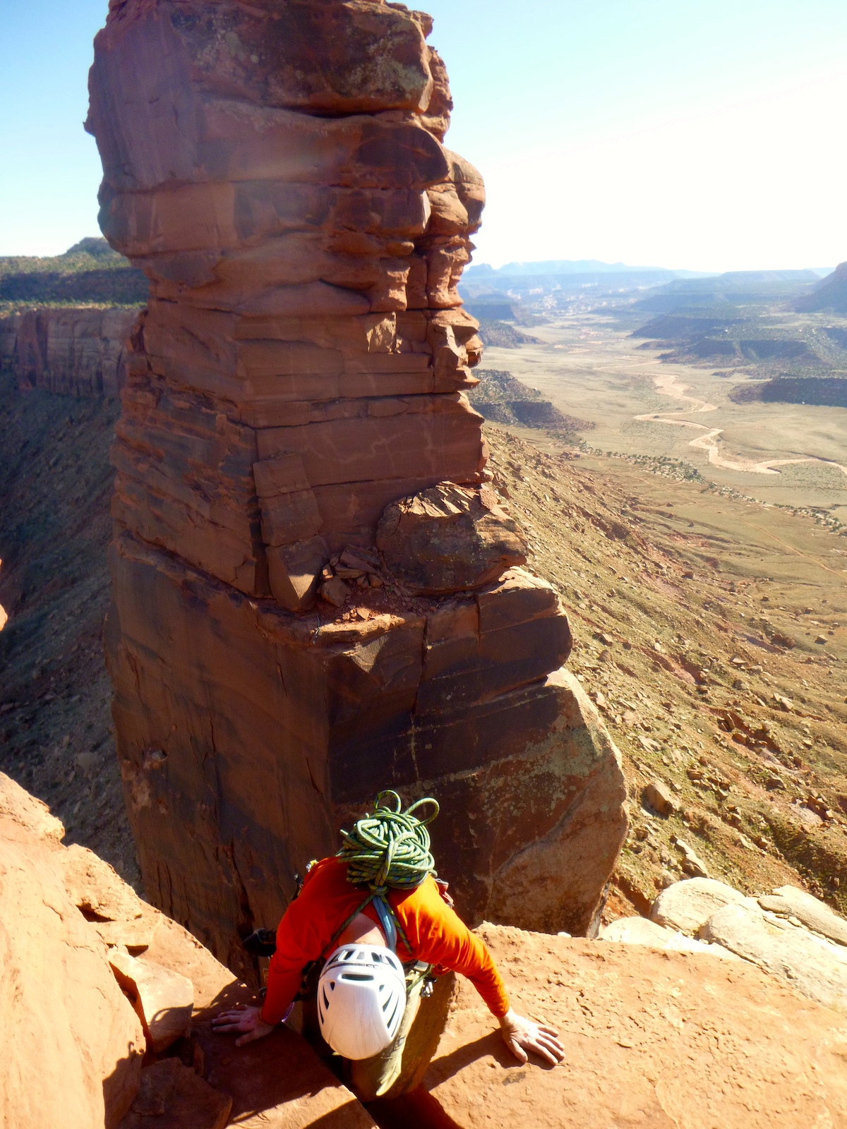 Ryan Franz down climbs from the summit of Bridger Jack Butte to access a rappel station in April 2015. The King of Pain pinnacle is in the background. The area is part of the Bears Ears National Monument designated by outgoing President Barack Obama on December 28, 2016. [Photo] Derek Franz